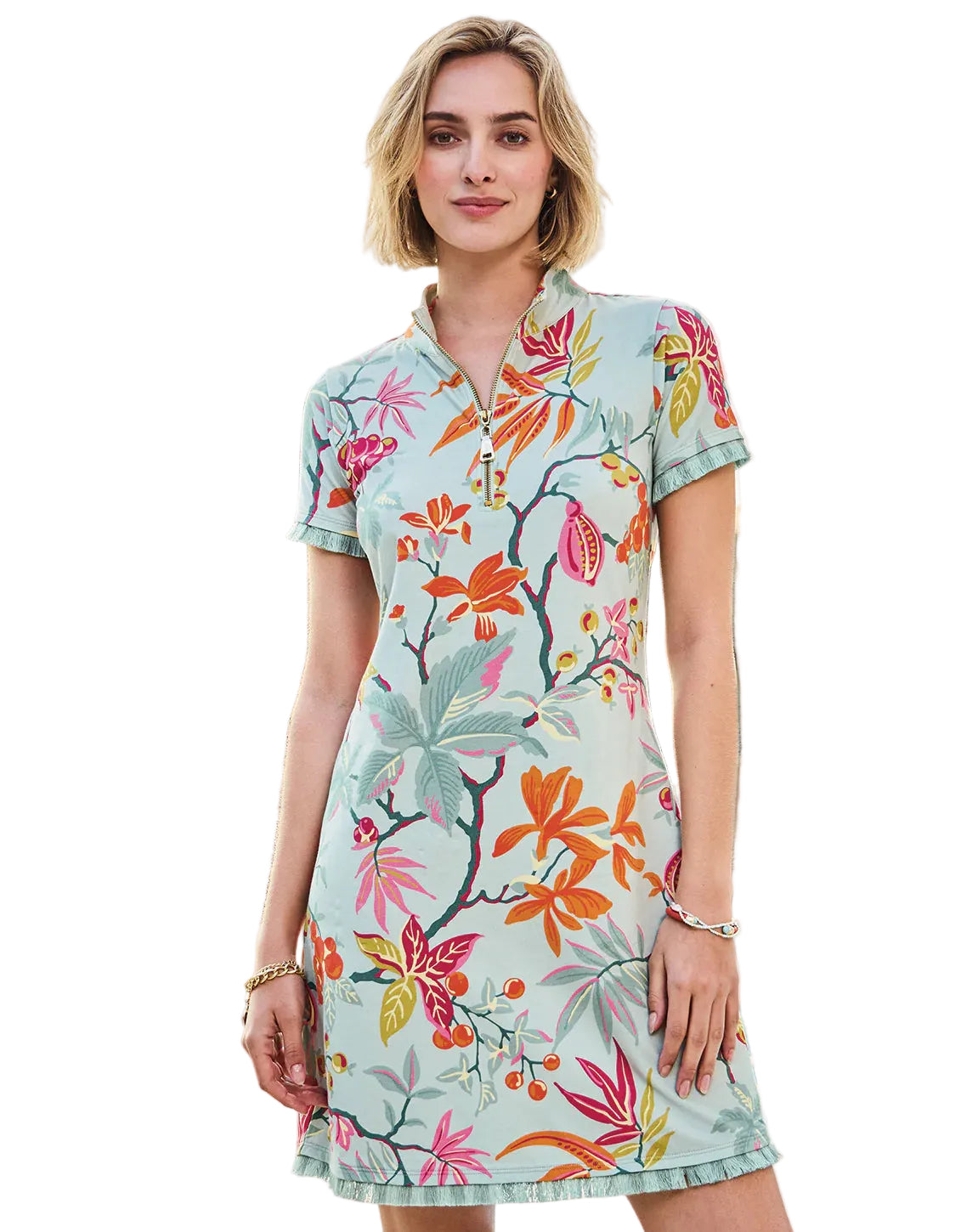 Woman wearing a floral dress by a poolside