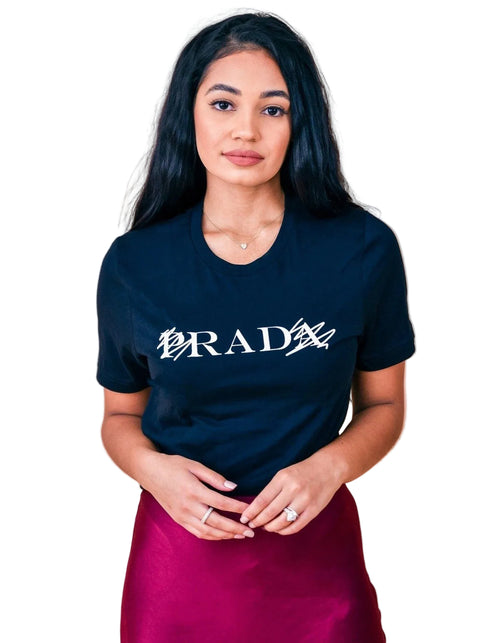 Woman wearing a black t-shirt with 'RAD' design on a beige background