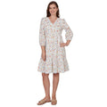 Woman wearing a floral dress on a white background