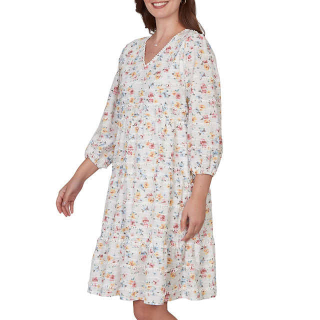 Woman wearing a floral dress on a white background